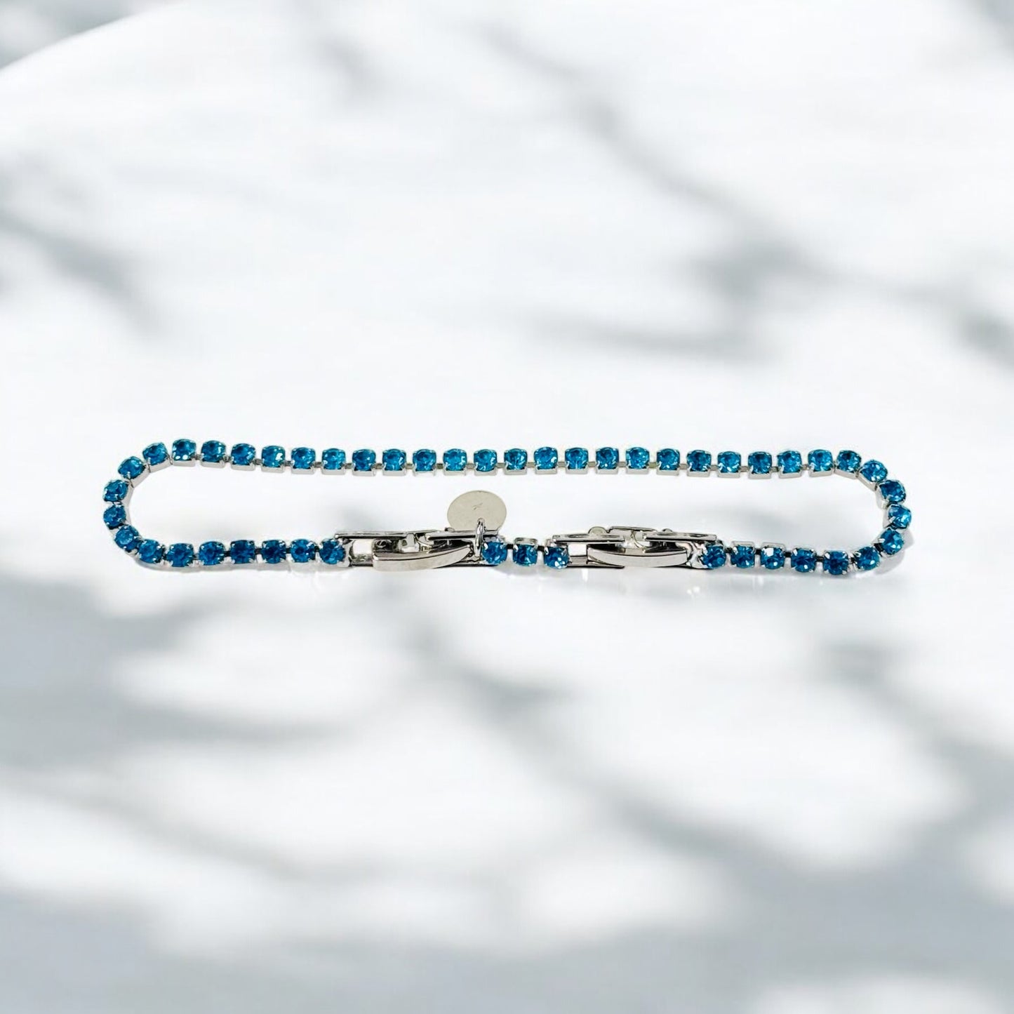 Tennisarmband mit Zirkonia / Türkisblau